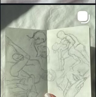 Sketchbook spread of figure studies